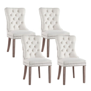 Set of four Artiss Dining Chairs Beige Velvet arranged symmetrically around a grand wooden dining table.