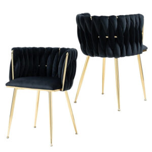 Pair of SERENITà black velvet woven dining chairs with luxury gold legs positioned in a modern dining room