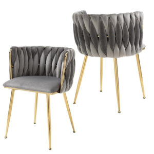 Pair of SERENITà grey velvet woven dining chairs with luxury gold legs positioned in a modern dining room